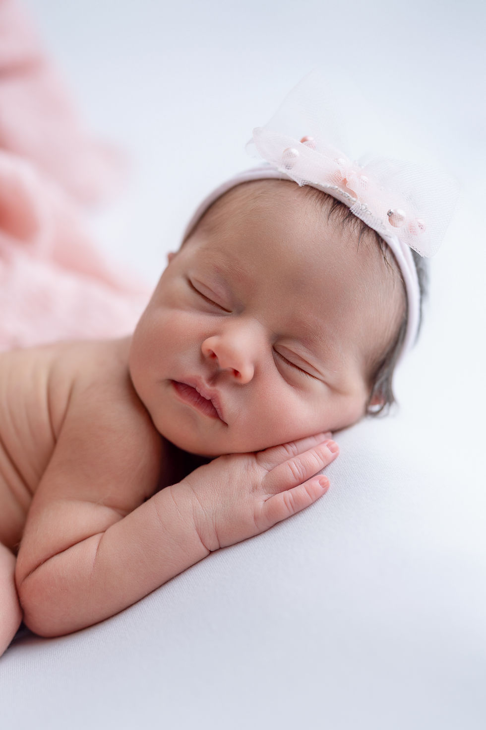 Newborn portrait that illustrates why baby’s first portraits become family heirlooms by Photowjoa in Clermont area