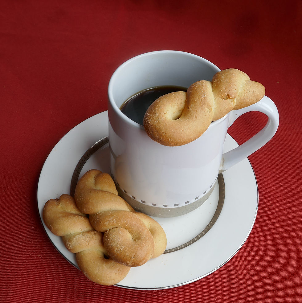 Close-up view of traditional koulourakia with a cup of coffee
