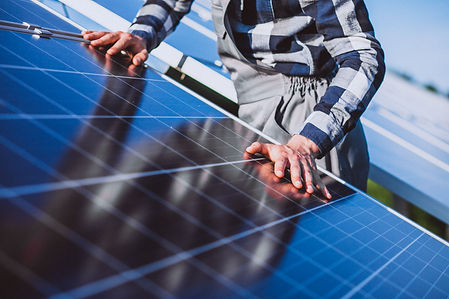 man-worker-firld-by-solar-panels.jpg