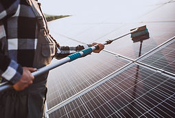 man-worker-firld-by-solar-panels.jpg