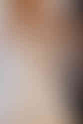 mother of bride and maid of honor dressing bride in gown using victorian button hook