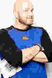 Man holding cross stitch embroidery hoop