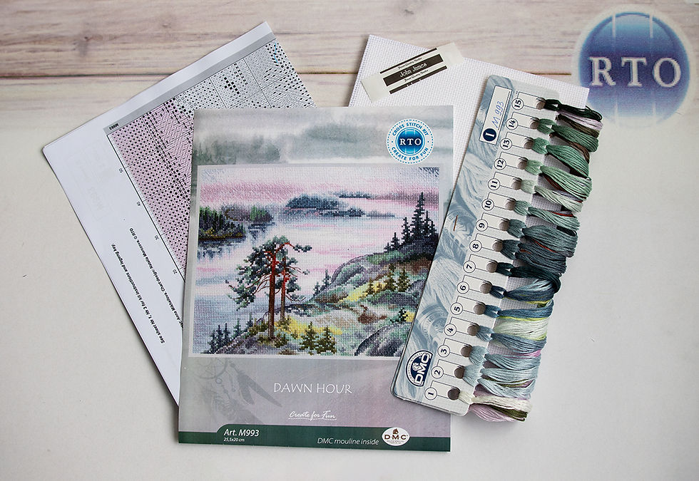Cross-stitch kit featuring a landscape design with thread, patterns, and a "Dawn Hour" label. Neutral tones create a calm mood.