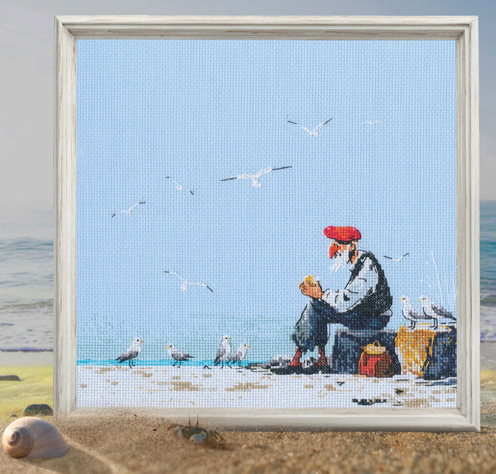 Framed painting of a man in a red hat sitting on a beach, surrounded by seagulls, holding bread. Ocean and sky are in the background.