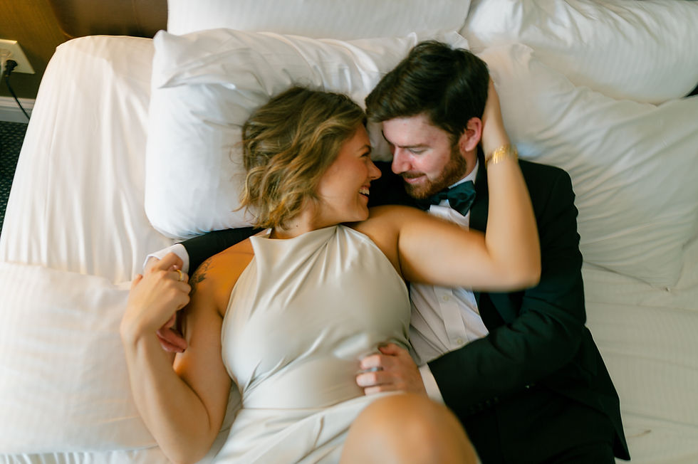Candid shot of engaged couple laughing while exploring The Logan Hotel