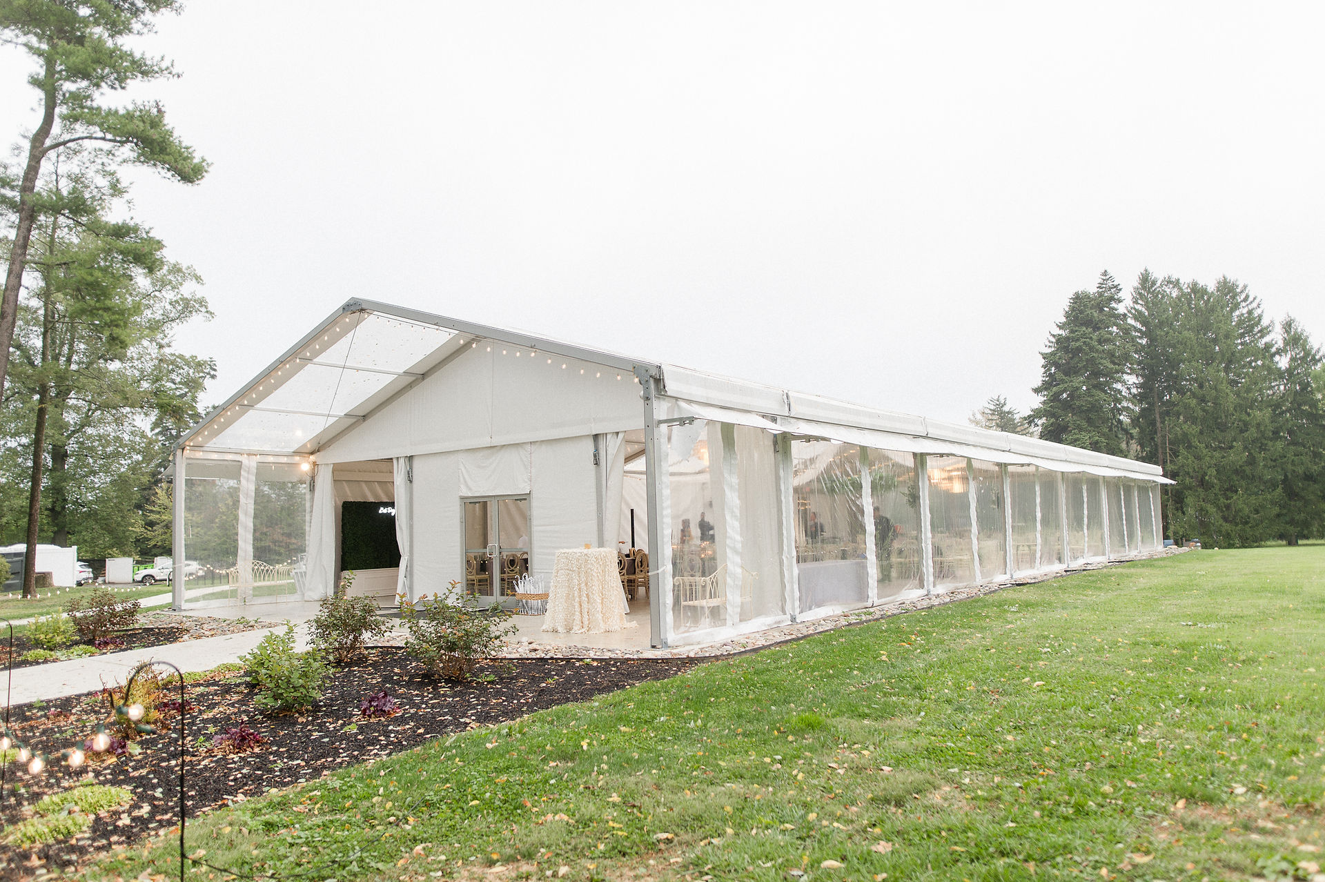 Greenhouse at at Bellevue Hall, in Wilmington, Delaware, in the rain set up for a wedding. 