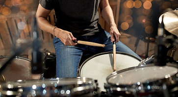 music-people-musical-instruments-entertainment-concept-male-musician-drummer-playing-drums
