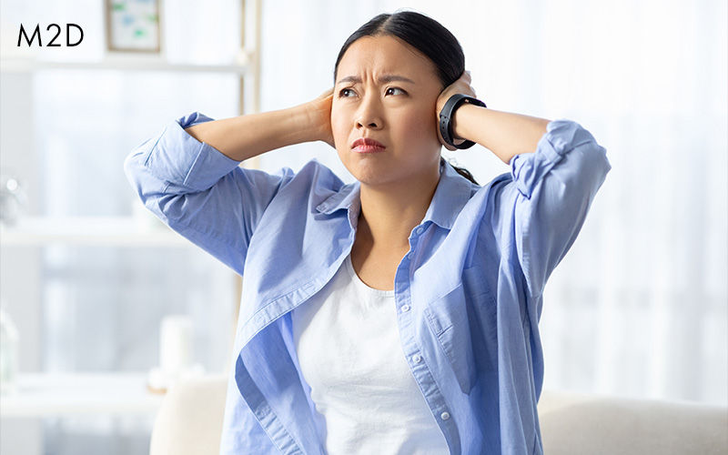 A person struggling with noise at home