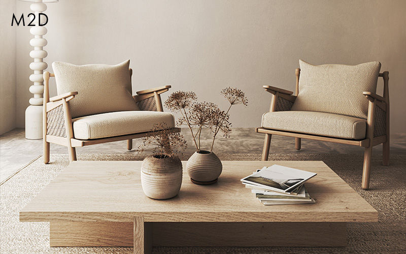 Minimalist living room with two beige armchairs and natural decor
