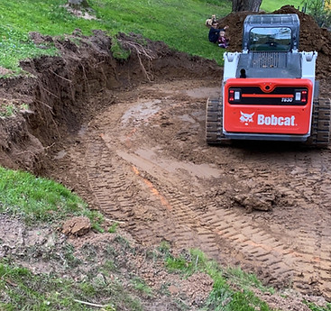 Excavation preformed for retaining wall