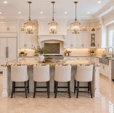 Traditional cream kitchen with a decorative range hood, glass-front upper cabinets, and a large island with seating.