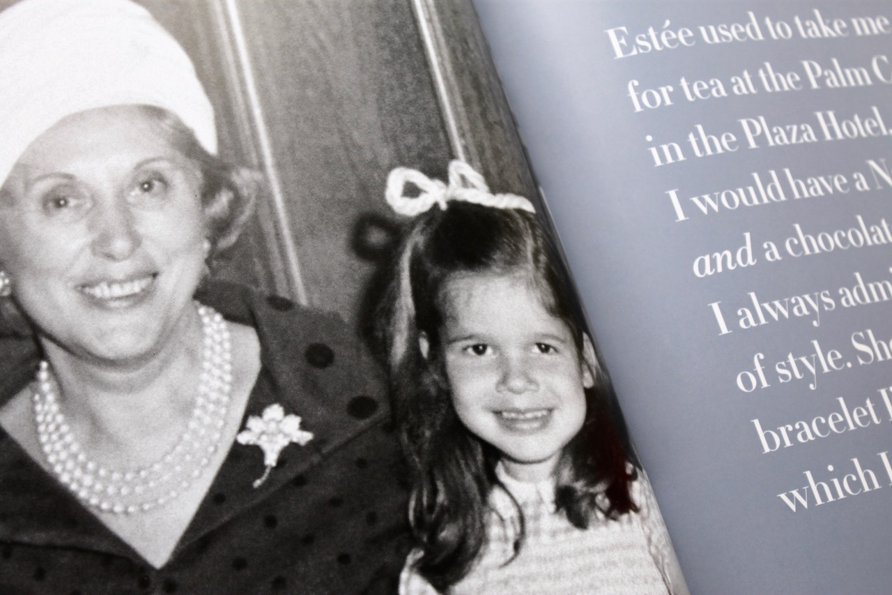Black and white photo of a smiling woman and girl. The woman wears pearls and a hat. Text on the right reads about tea at the Plaza Hotel.