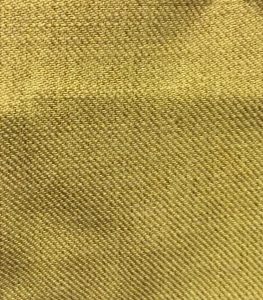 Close-up of textured yellow fabric with a diagonal weave pattern. No visible text or significant actions. Simple and vibrant.