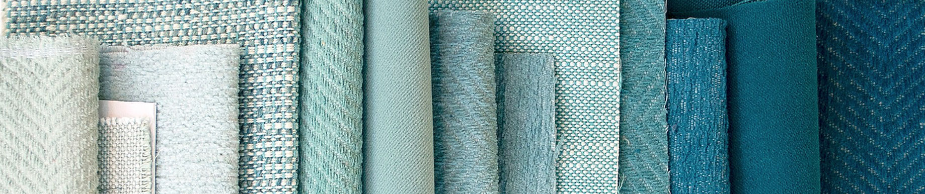 Various teal and turquoise fabric swatches are arranged vertically, featuring textured patterns and weaves, creating a calm, stylish mood.