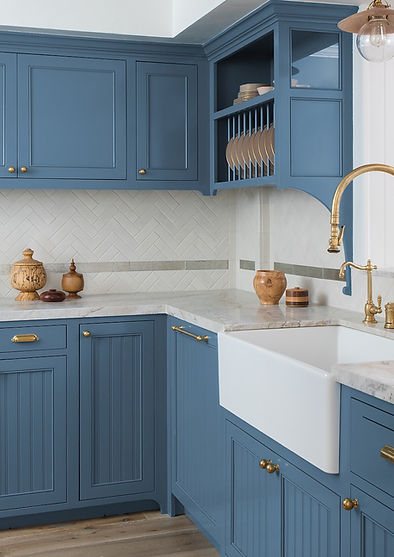 Classic blue kitchen with custom cabinetry, quartzite countertops, hand-made tile backsplash, Farrow & Ball paint, and brass fixtures and hardware, designed by Stefani Stein