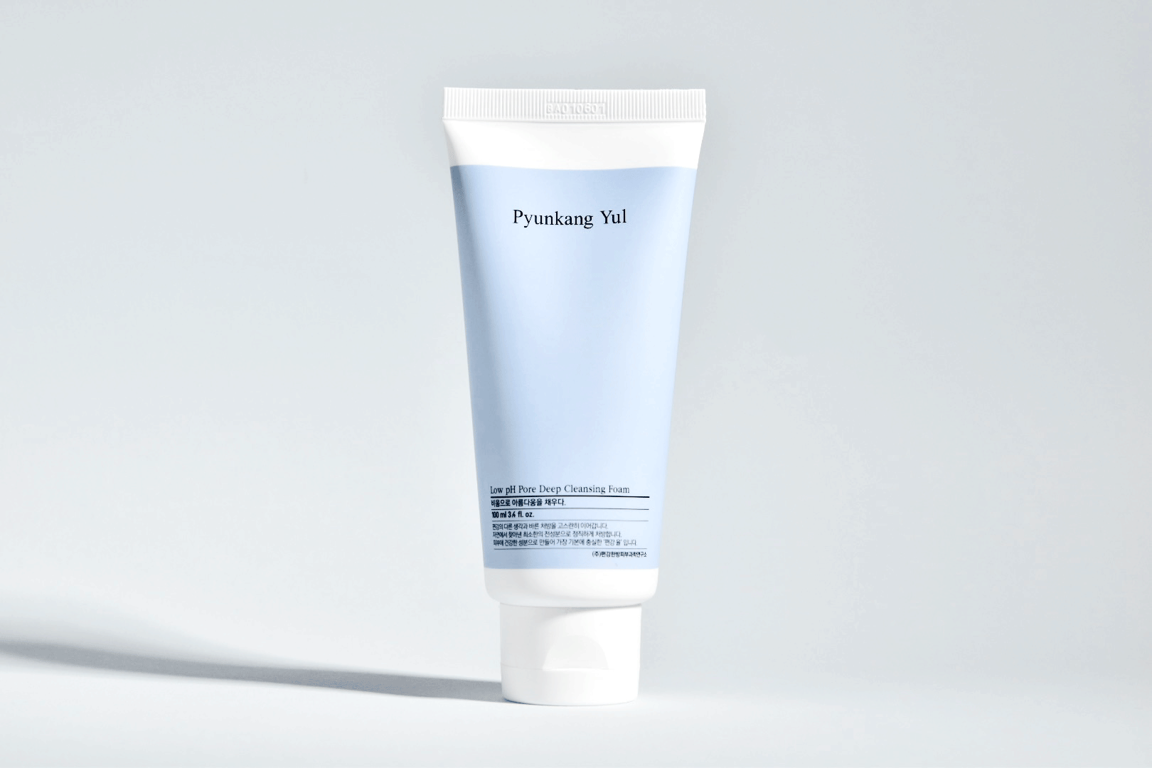 Pyunkang Yul Low pH Pore Deep Cleansing Foam in a sleek light blue tube, emphasizing its gentle formula for deep pore cleansi