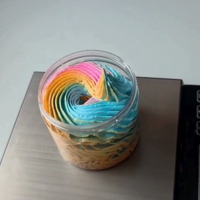 Thumbnail: a video of bright coloured whipped soap being piped into a jar