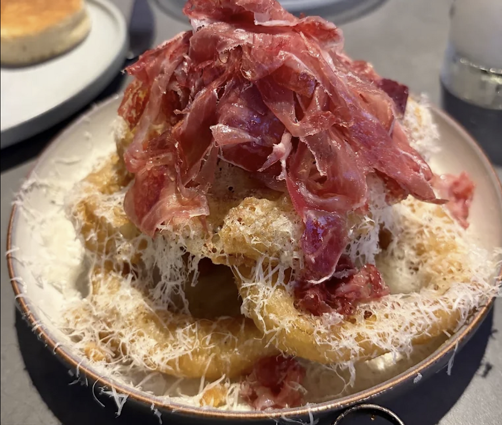 onion rings with iberico and marchego cheese from Bicyclette Cookshop in Naples, FL