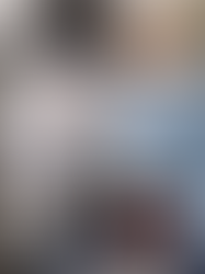 woman taking laundry from dryer