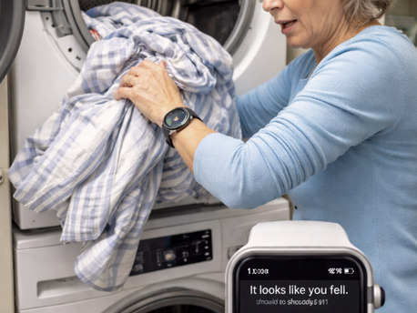 woman taking laundry from dryer