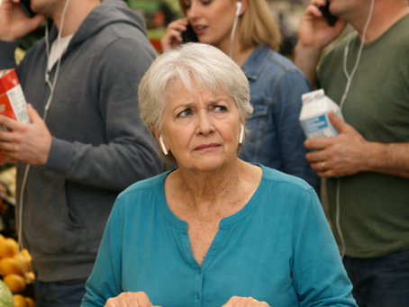 woman in grocery surrounded by people with earbuds
