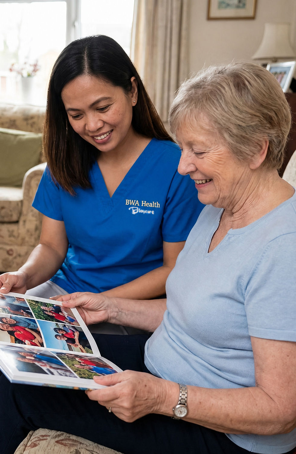 Blay Carer going through photo album with client