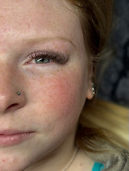 Brown lash extensions Volume 5D full set on one eye, showing natural soft wispy texture on client.