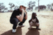 Crouching with a kid.jpeg
