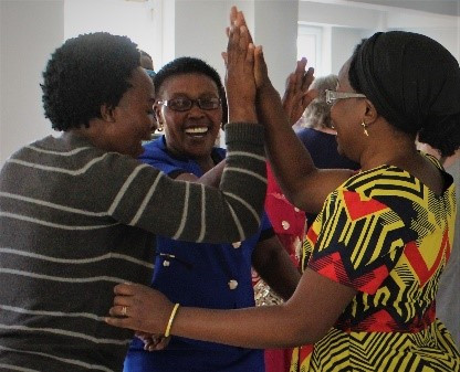 group of women giving high fives