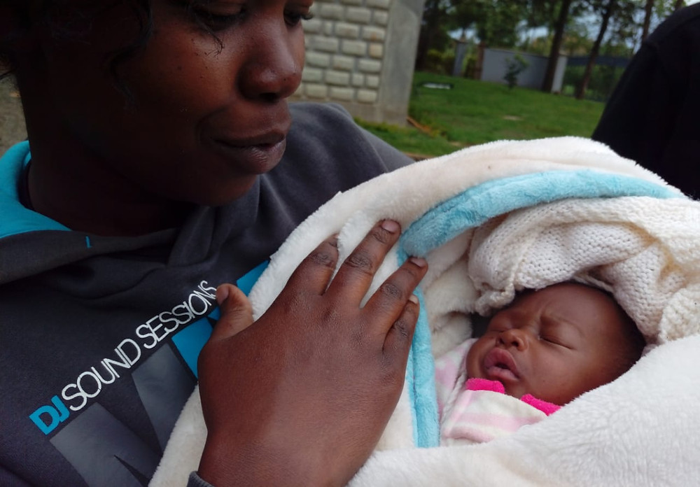 woman holding baby