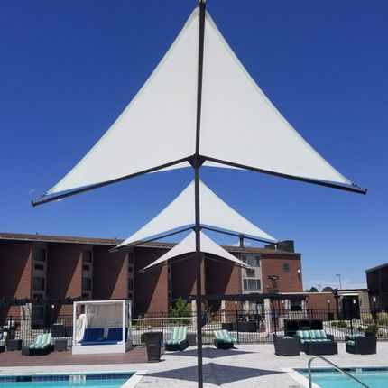 "Residential steel pergola with solar shade material, providing UV protection and a stylish upgrade to outdoor spaces