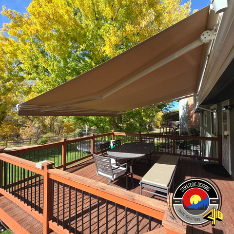Stylish retractable awning installed on a commercial storefront, enhancing curb appeal and providing adjustable shade