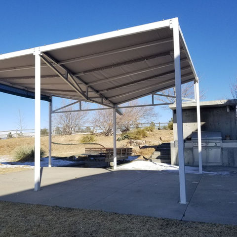 Pergola enhanced with solar fabric, blocking UV rays while maintaining a sleek and modern design