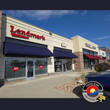 Commercial awning with custom graphics, showcasing a fully welded frame and fabric design for a professional storefront