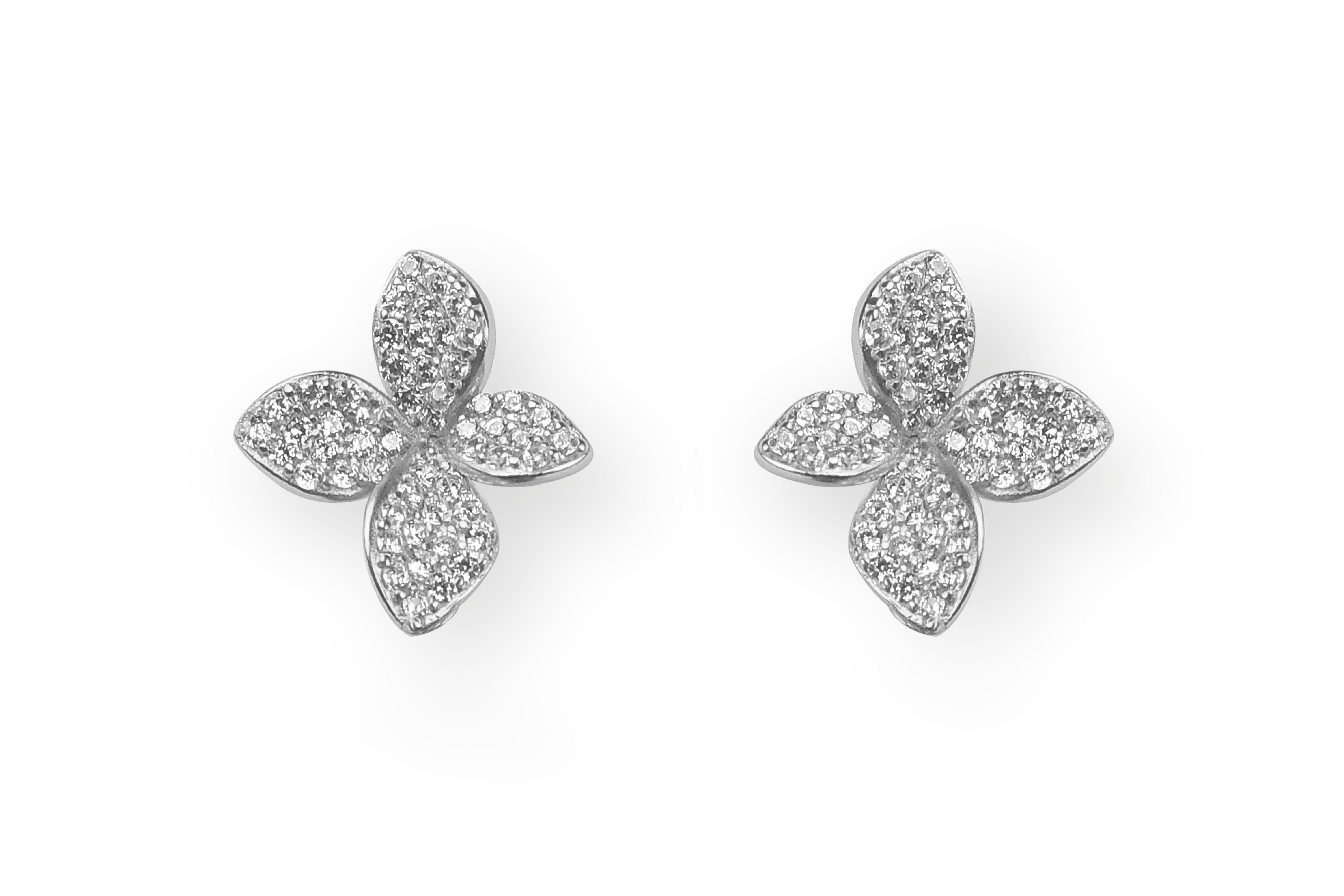 Silver rhodium pavé CZ four-petal flower stud earrings on black background