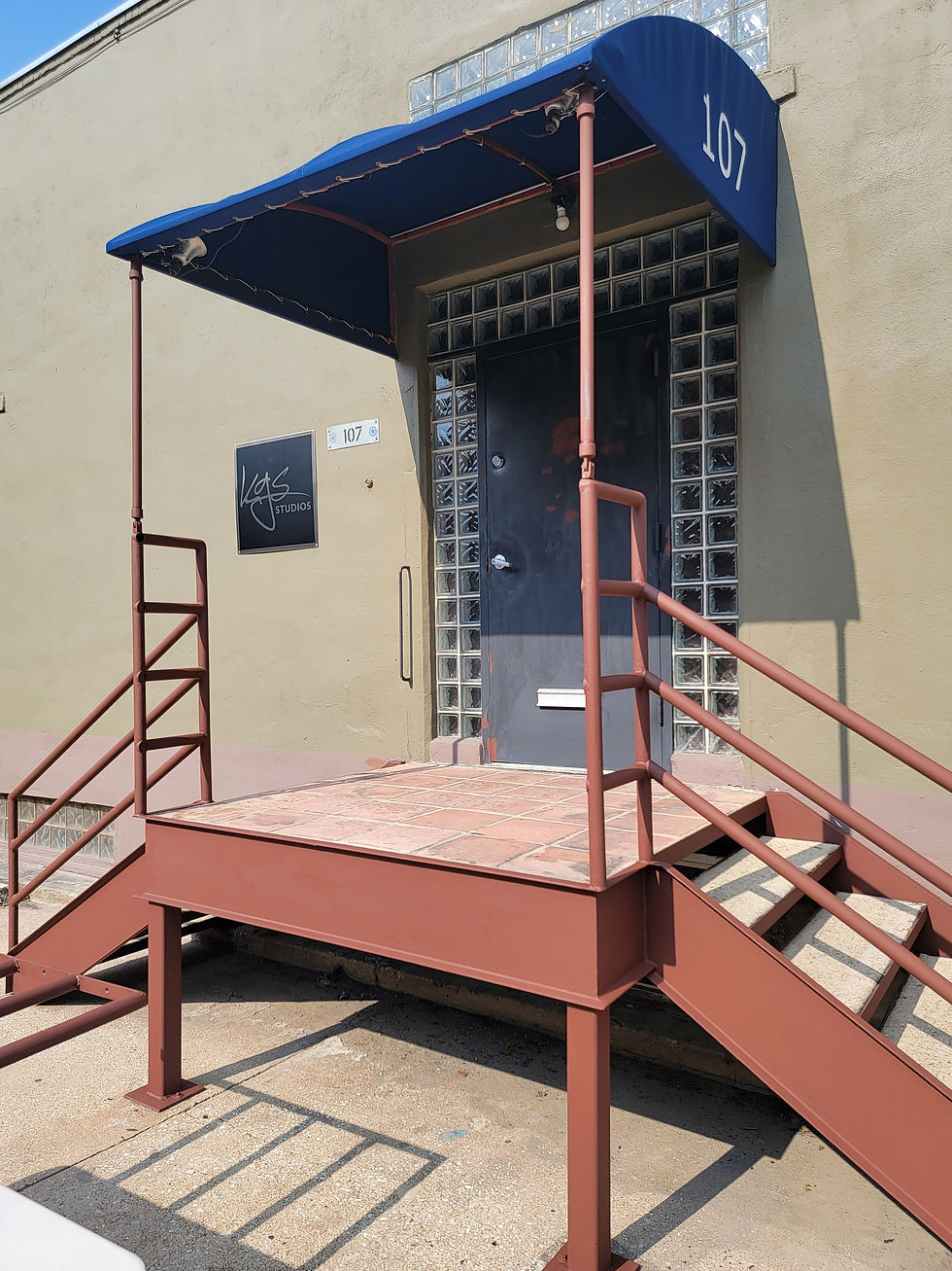The KGS Studios front porch has primer