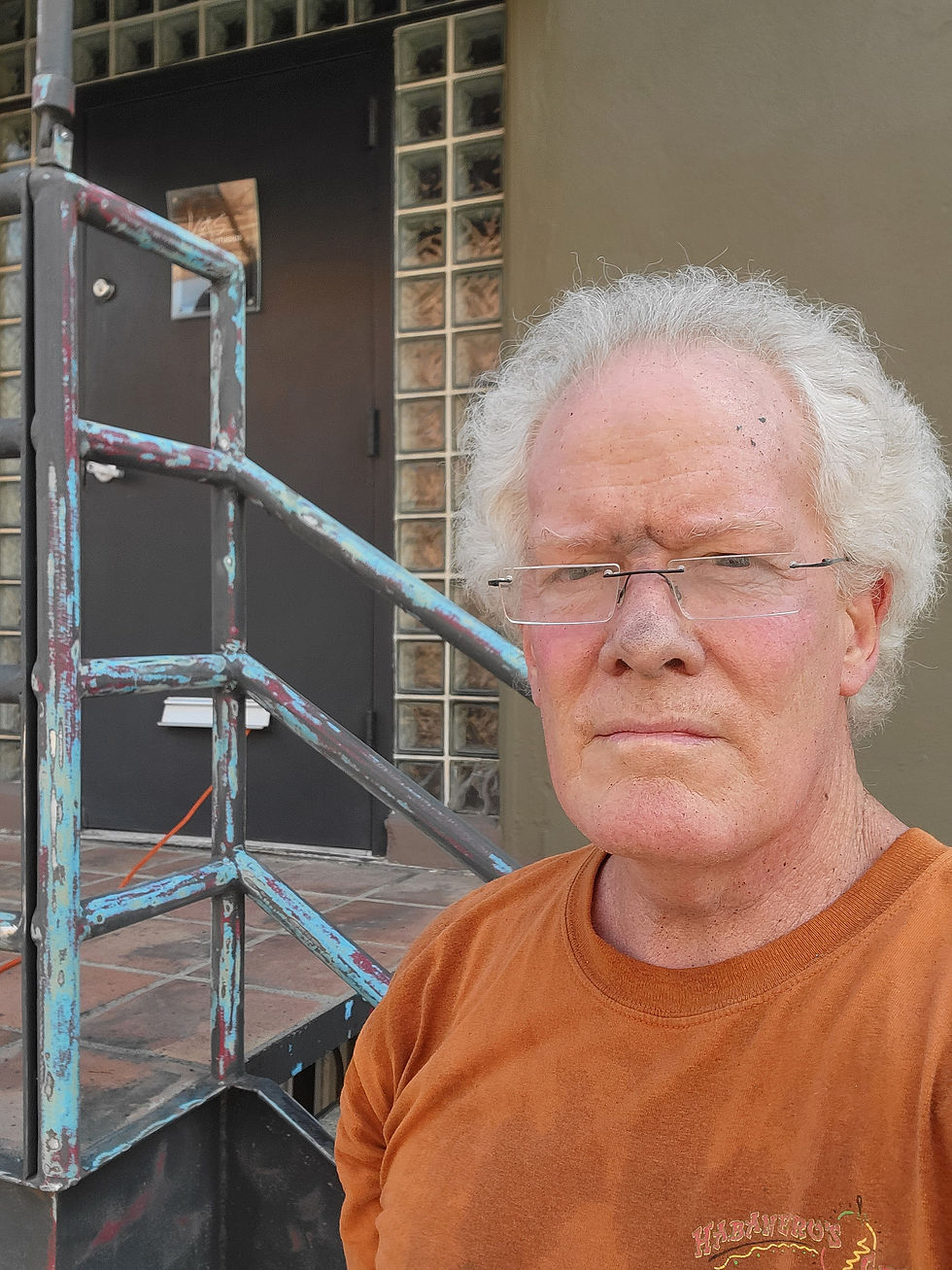Kevin Saunders shown stripping old paint from KGS Studios