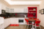 Kitchen and dining area in Geranium apartment