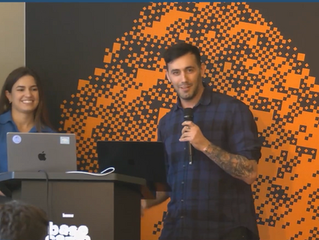 Matthew Meakin presenting the Rocky concierge app on stage at BASE Camp 2025, with Claudia Haddad from Coinbase’s Base team.
