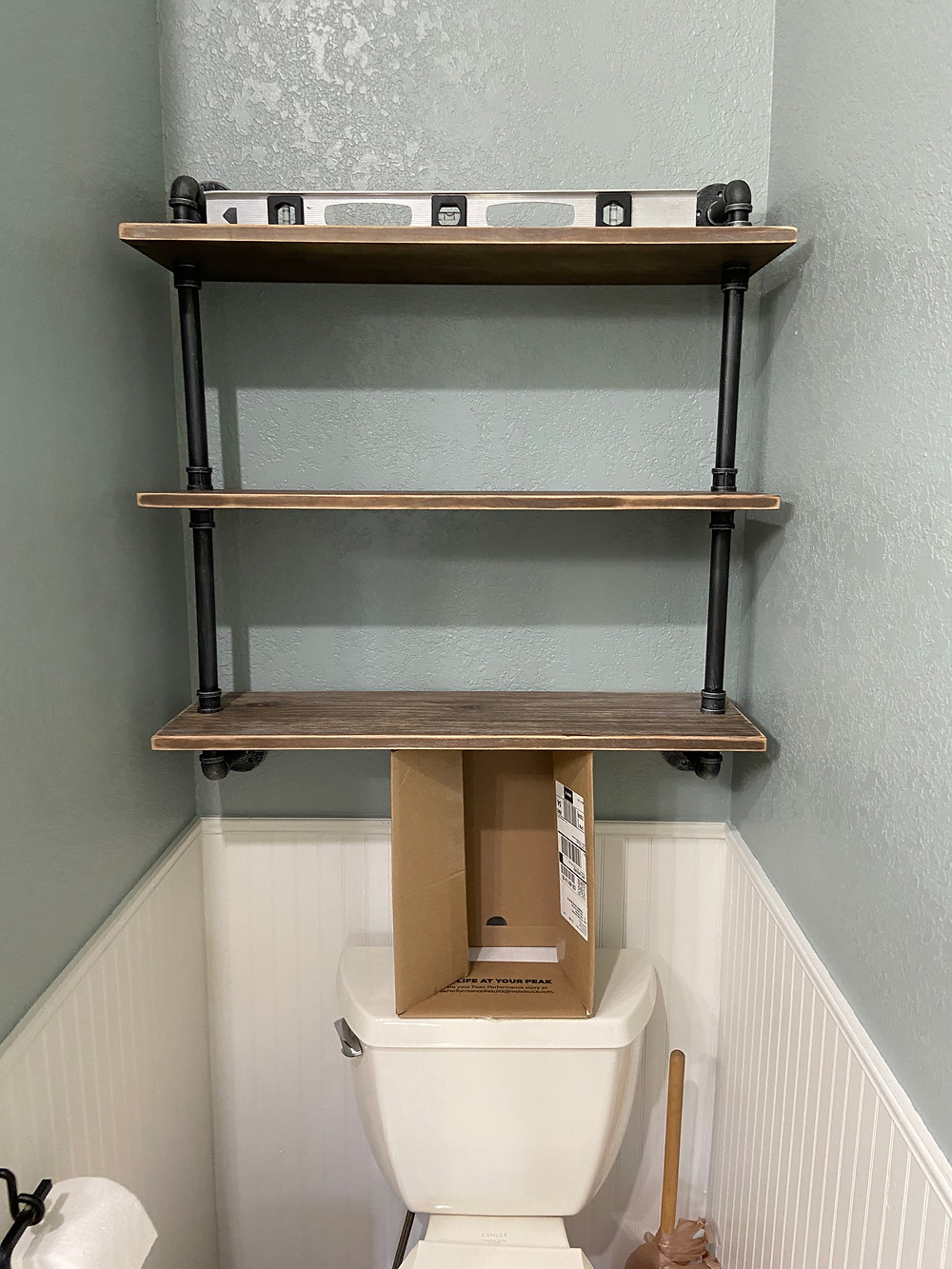 shelf above toilet