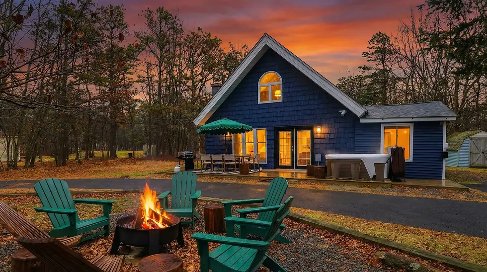 Blue Tail Chalet exterior with fire pit and hot tub, direct book Long Pond PA Pocono Mountains chalet