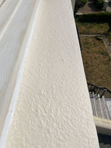 Stripping and repainting a customers peeling paintwork on an outside window ledge in Hove.