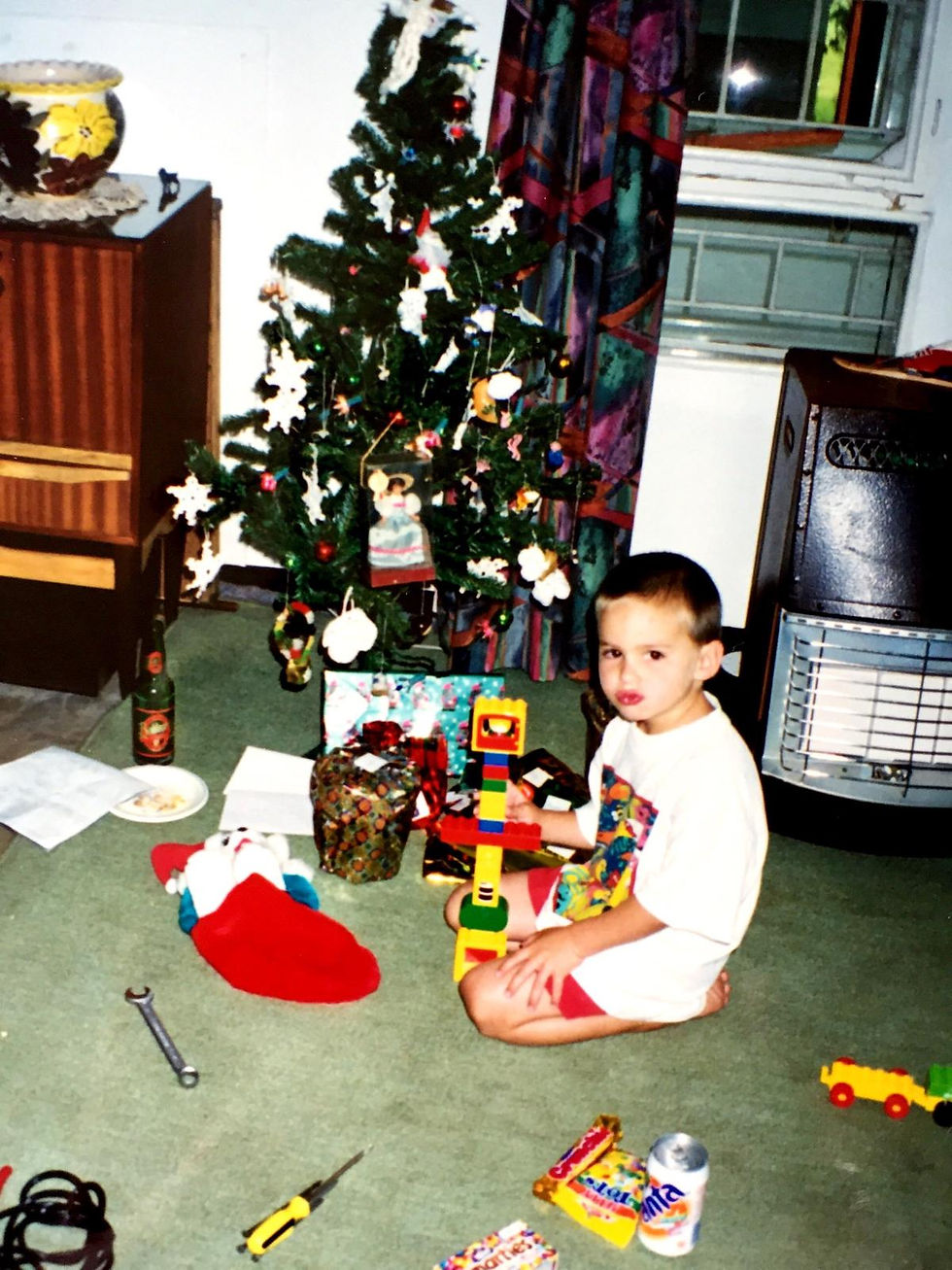 Selby opening his presents on the Cary family farm, Cockington, Darwendale.