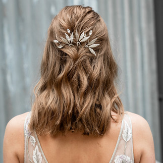 silver and ivory leaves, crystal bridal hair pins styled in dark blonde waved hair
