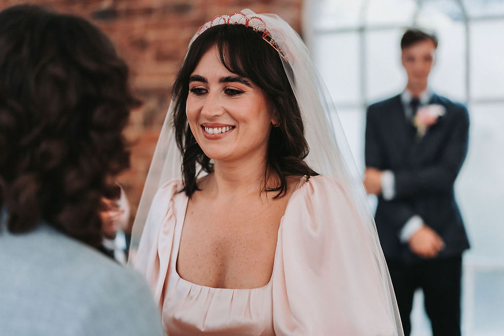 Brunette bride wears a bespoke pink crystal crown to go with her pink veil and pink wedding dress, for her Liverpool city centre wedding