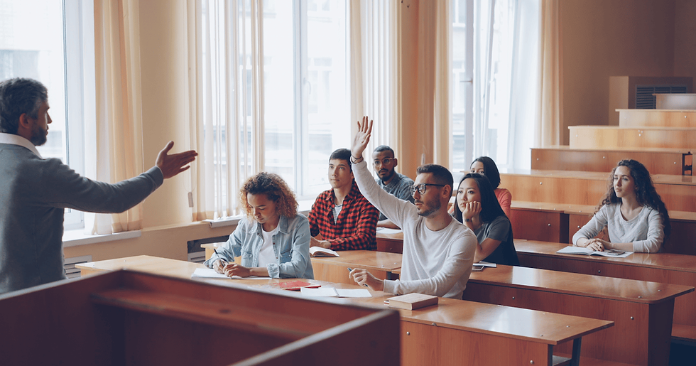 Engaged students raising hands in Zoho CRM training lecture hall representing critical questioning before choosing a training program
