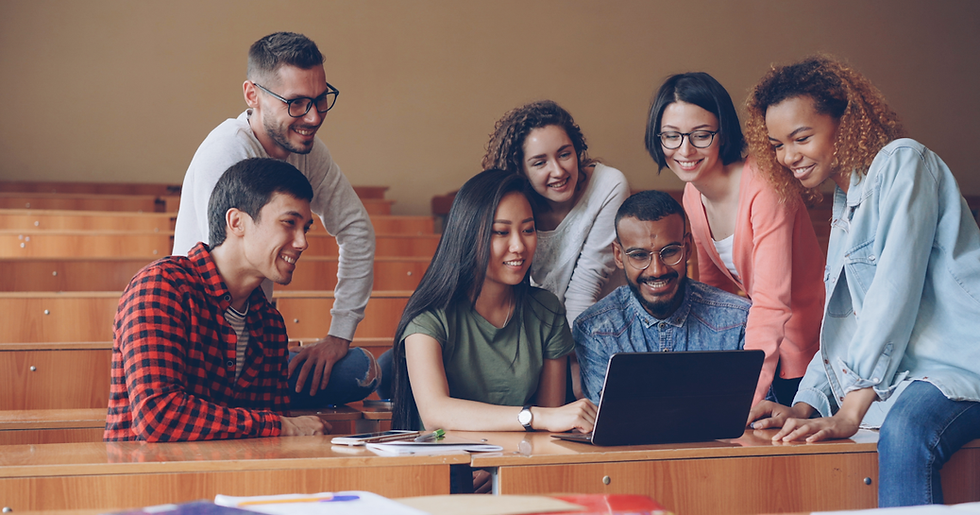 Diverse group of students collaborating around laptop in video conference representing entry-level Zoho CRM training stage