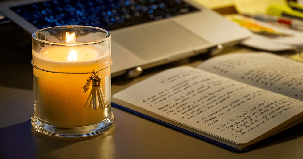 Focused late-night study desk with candle and handwritten notes representing dedicated preparation needed alongside short Zoho CRM course