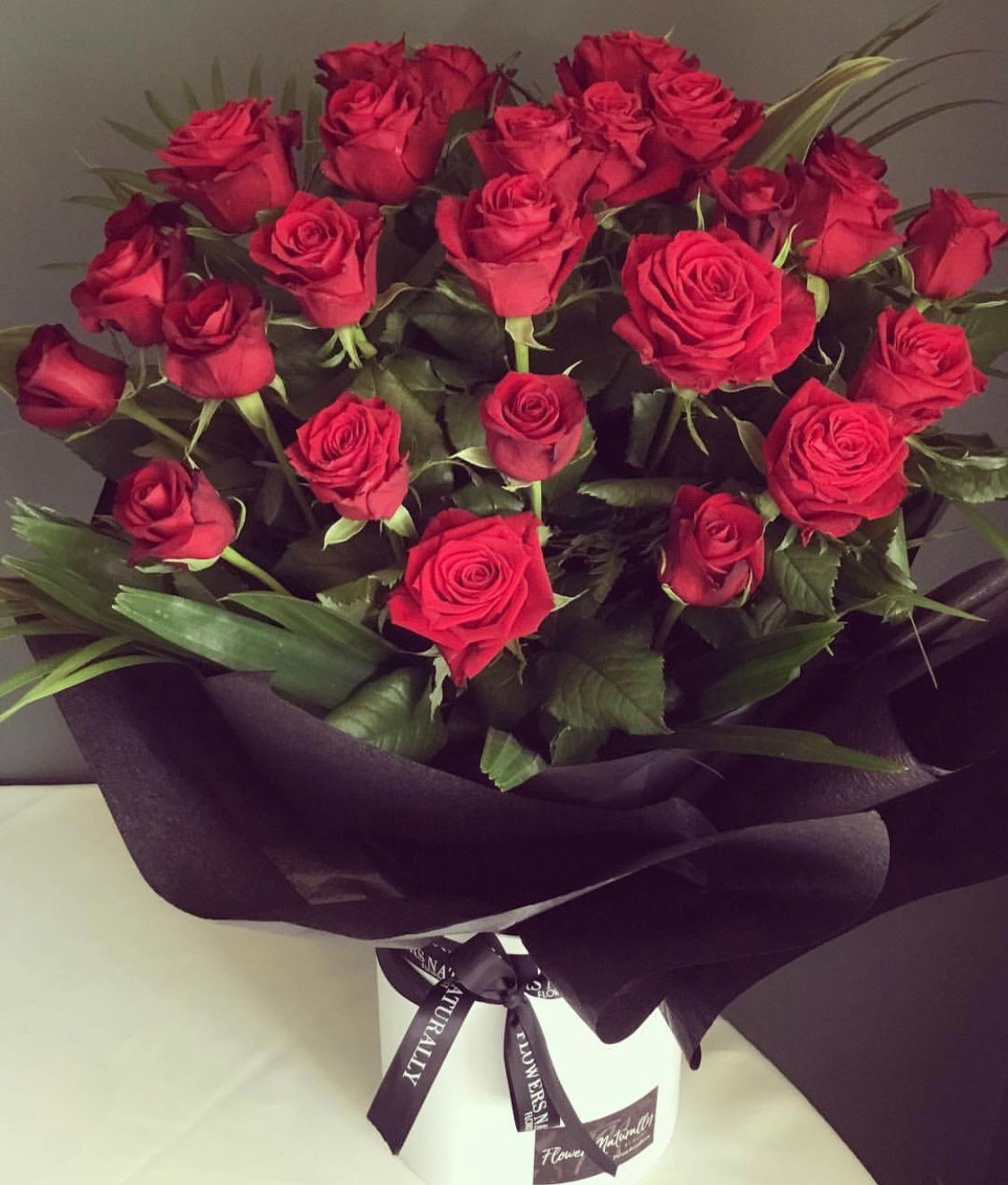 Deluxe roses in hat box- 24 stems 