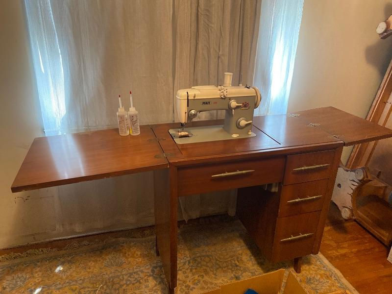 Not my mom's acutal machine, this photo is just about as close as I can get to what it looked like.  Photo found on: https://estatesales.org/online-auctions/vintage-pfaff-sewing-machine-with-45672191